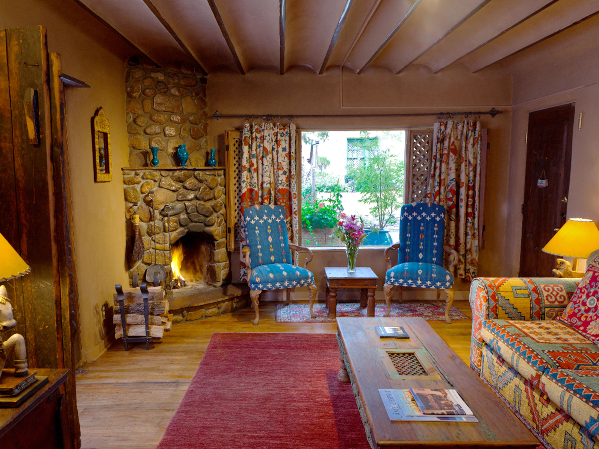 Two bedroom suite living room with fireplace at The Inn of The Five Graces